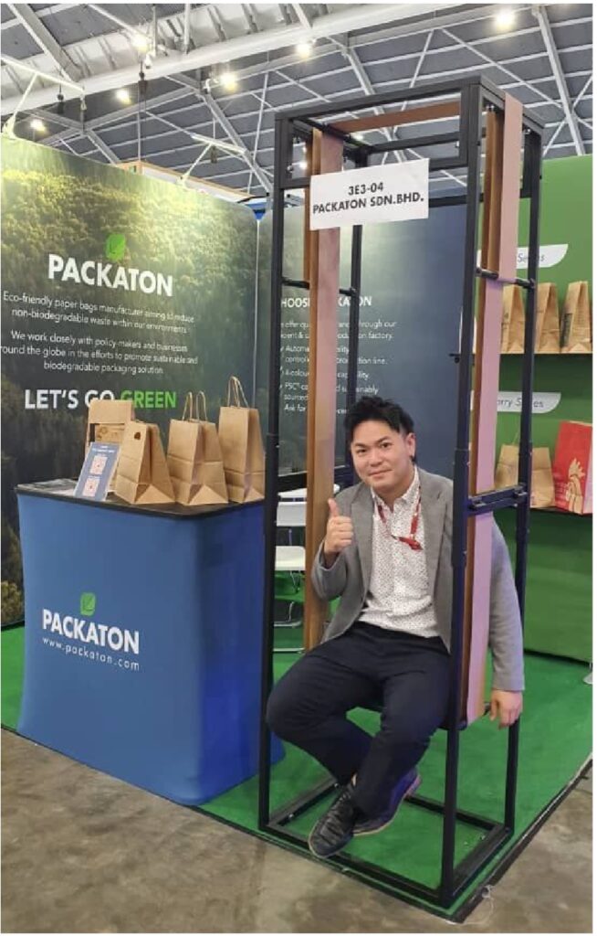 a man sitting on the swing made of PXL's durable paper bag
